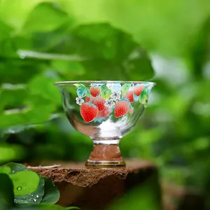 Exquisite glass tea cup with strawberry pattern, elegant master cup for daily tea tasting.