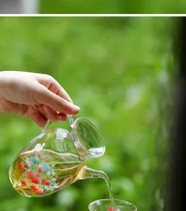 Clear glass teapot with cute strawberry pattern, heat-resistant borosilicate glass for home use.