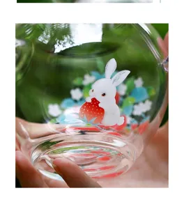 Clear glass teapot with cute rabbit and strawberry pattern, high borosilicate heat resistant.
