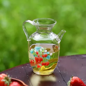 Clear glass teapot with strawberry pattern, heat-resistant borosilicate glass pitcher.
