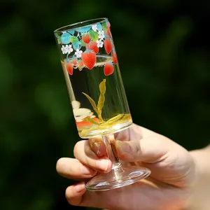 Cute strawberry patterned glass goblet for home daily drinking, elegant tea tasting cup.