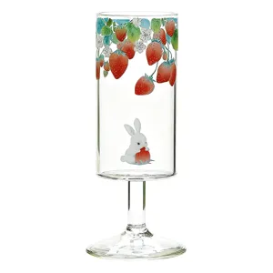 Clear glass goblet featuring a cute strawberry and rabbit design, perfect for home daily use.