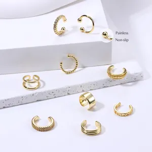 Detail shot of gold ear cuffs, painless non-slip design, minimalist daily jewelry.