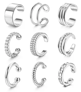 Detailed view of various minimalist silver ear cuffs, featuring sleek non-pierced designs.