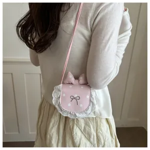 Korean cute mini polka dot shoulder bag with lace trim and bow, sweet style crossbody accessory.