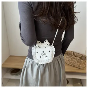 Korean cute mini shoulder crossbody bag with polka dots, lace trim and sweet bow for women.