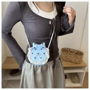 Detailed view of the cute Korean style mini polka dot lace bow crossbody bag worn by model.