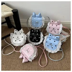 Detail view of cute Korean style mini polka dot lace bow crossbody bags in multiple sweet colors.