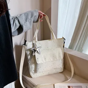 Stylish large canvas tote bag for women, commuter shoulder bag with star print design.