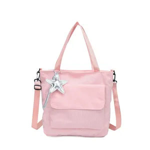 Stylish pink corduroy tote bag for women, large capacity shoulder bag with a cute star pendant.