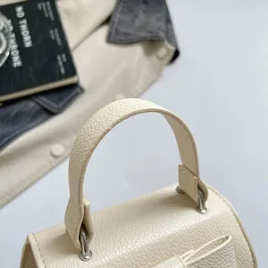 Cute mini girls handbag in off-white PU leather, stylish casual solid color top handle bag.