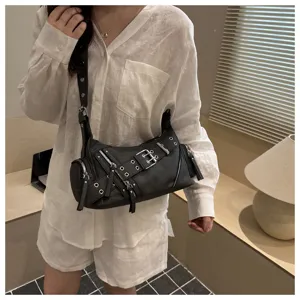 Vintage motorcycle shoulder bag for women, edgy punk style crossbody bag with metal buckles.