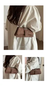 Detail view of the stylish leopard print underarm shoulder bag with metal chain and buckle.