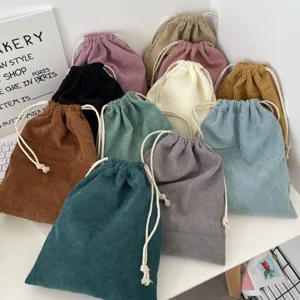 Colorful corduroy drawstring storage pouches showing a rich ribbed fabric texture