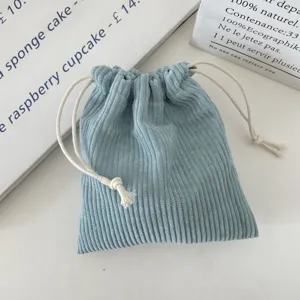 Close-up of a blue corduroy drawstring storage bag pouch