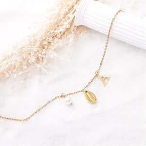 Gold stainless steel initial letter A charm, shell and pearl anklet detail view.
