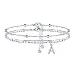 Ensemble de chevillères multicouches argentées avec pendentif lettre A et zircon.
