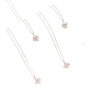 Elegant rose gold four-leaf clover pendant necklace with sparkling cubic zirconia crystals.