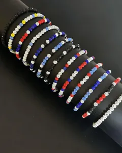 Detailed close-up view of colorful beaded necklaces featuring sparkling rhinestones.