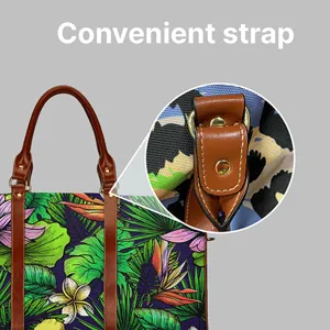 Detailed view of the stylish travel bag strap attachment and vibrant tropical plant print.