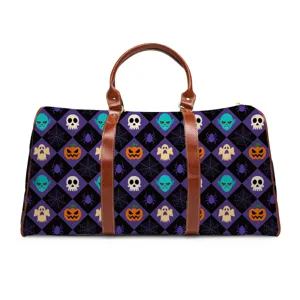 Halloween theme travel duffel bag with skull ghost pumpkin print and brown leather handles.