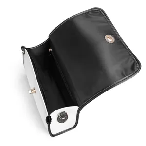 Bolso de hombro para mujer de cuero PU negro y blanco, detalle interior del compartimento amplio.