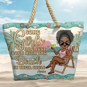 Detail shot of the canvas beach tote bag with customized cartoon graphic and rope handles.