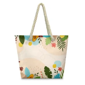 Canvas beach tote bag with tropical leaf print and rope handles, front view standard display.