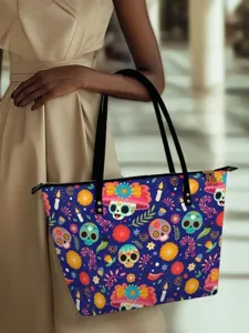 Stylish canvas shoulder tote bag featuring vibrant Mexican sugar skull and floral holiday print.
