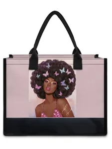 Canvas tote bag featuring a stylish Afro girl and butterfly illustration with black handles.