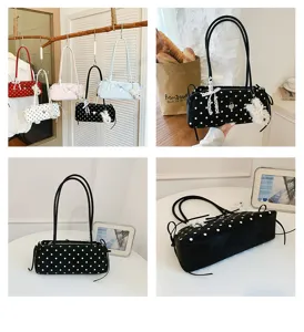 Korean style polka dot underarm shoulder bag with cute lace bow and pendant for daily use.