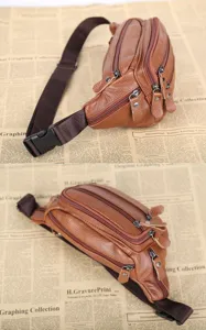 Detaillierte Ansicht einer braunen Leder-Gürteltasche mit mehreren Reißverschlüssen.