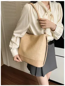 Elegant beige woven shoulder bucket bag for women, vintage leather crossbody bag, summer fashion style.