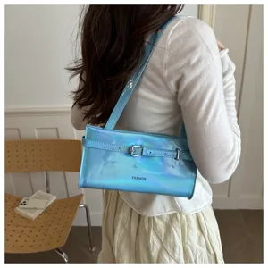 Stylish holographic blue shoulder bag detail showing metallic buckle and trendy fashion print.