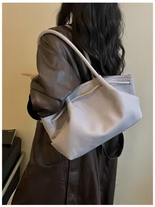 Stylish large capacity leather shoulder bag for women, niche French design hobo underarm handbag.