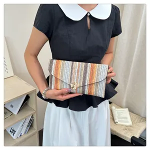 Woven colorblock envelope clutch bag for women, stylish ethnic pattern casual hand bag.