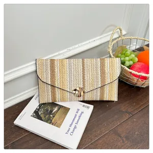 Woven envelope clutch bag, colorful striped design, stylish casual handbag detail view.