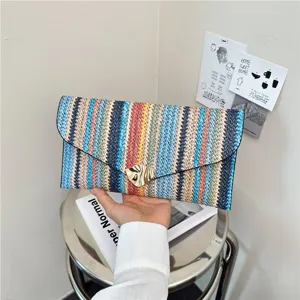Stylish colorful woven clutch bag for women, chic multi-color striped design with metal lock.