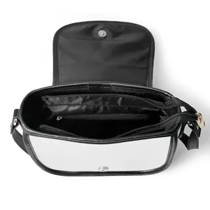Detailed view of the interior compartments and zipper pockets of a black PU saddle bag.