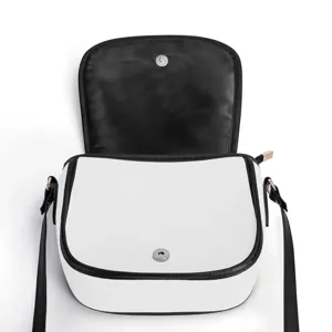 Close-up view of the open white saddle bag interior, showing black lining and clasp.
