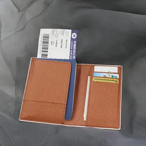 Brown PU leather passport holder detail, multi-card slots and travel document organizer.