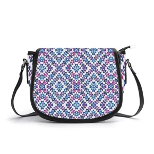 Ethnic geometric print PU saddle bag with black leather trim, stylish crossbody shoulder bag.