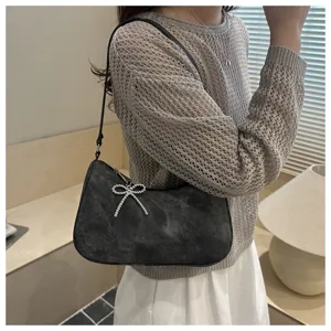 Stylish frosted underarm shoulder bag for women, featuring a chic rhinestone bow detail.