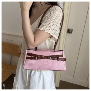 Detailed view of the sweet pink denim underarm shoulder bag featuring stylish brown belt buckle straps.