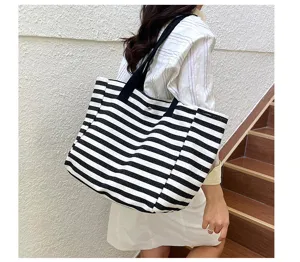 Canvas tote bag detailed view, black and white striped pattern, large capacity daily use.
