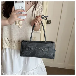 Stylish distressed denim underarm bag with unique belt buckle design for women daily use.