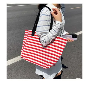 Red and white striped canvas tote bag details, large capacity commuter shoulder handbag.