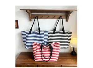 Detailed view of striped canvas tote bags, large capacity casual shoulder bags for women.