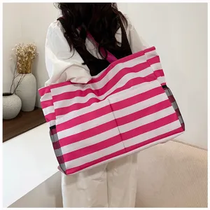 Pink white striped canvas tote bag large capacity casual shoulder bag for beach and shopping.