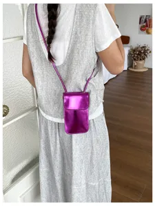 Metallic purple phone bag detail view, shiny leather mini crossbody pouch for daily wear.